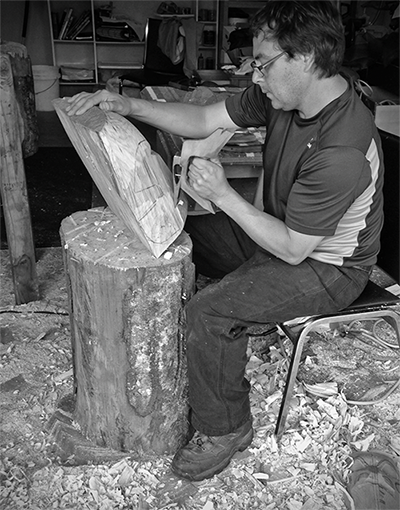 Brian Perry roughs out a mask with a D adze from a piece of alder